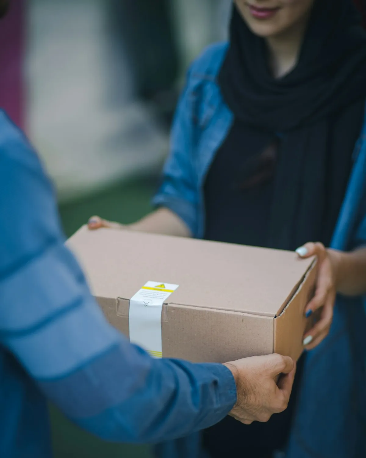 OTF Solutions courier handing off a secured medical delivery